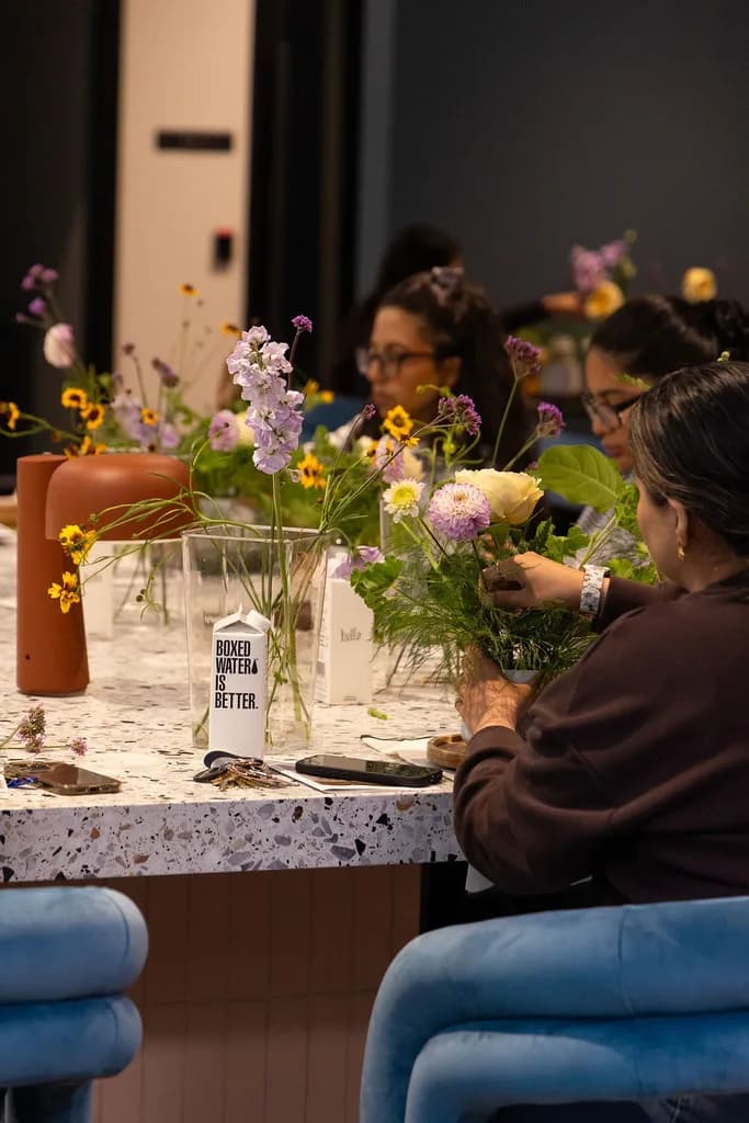 Guests arranging flowers at a floral workshop