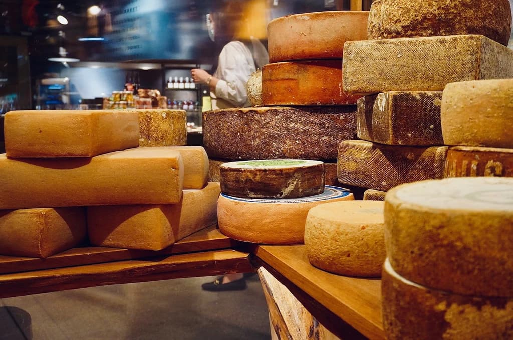 wheels of cheese on a table