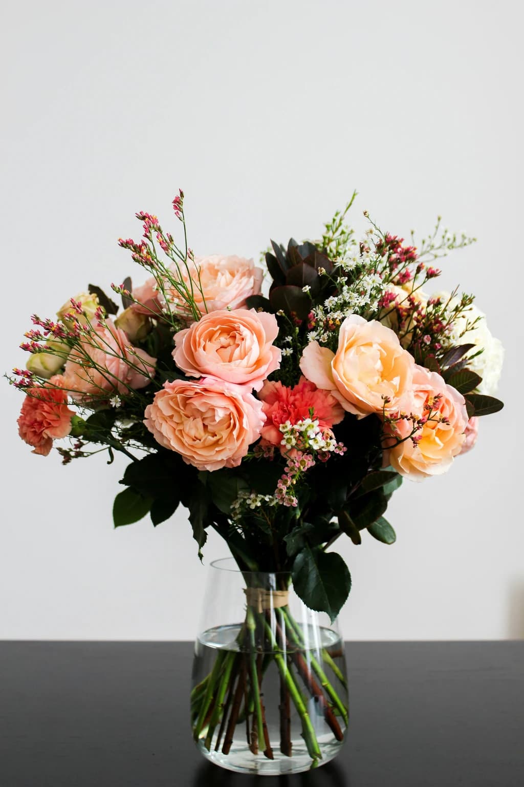 a bouque of flowers in a glass vase