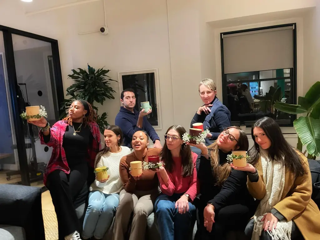 Attendees posing with their handmade candles