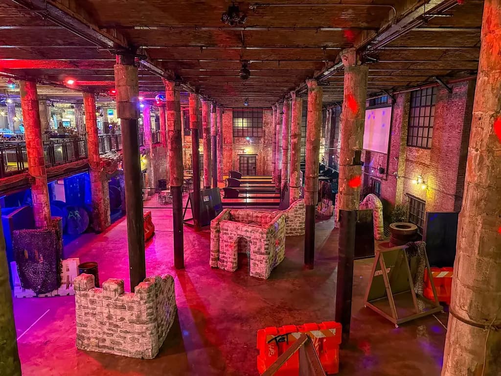 a birds eye view of an indoor aerial laser tag arena