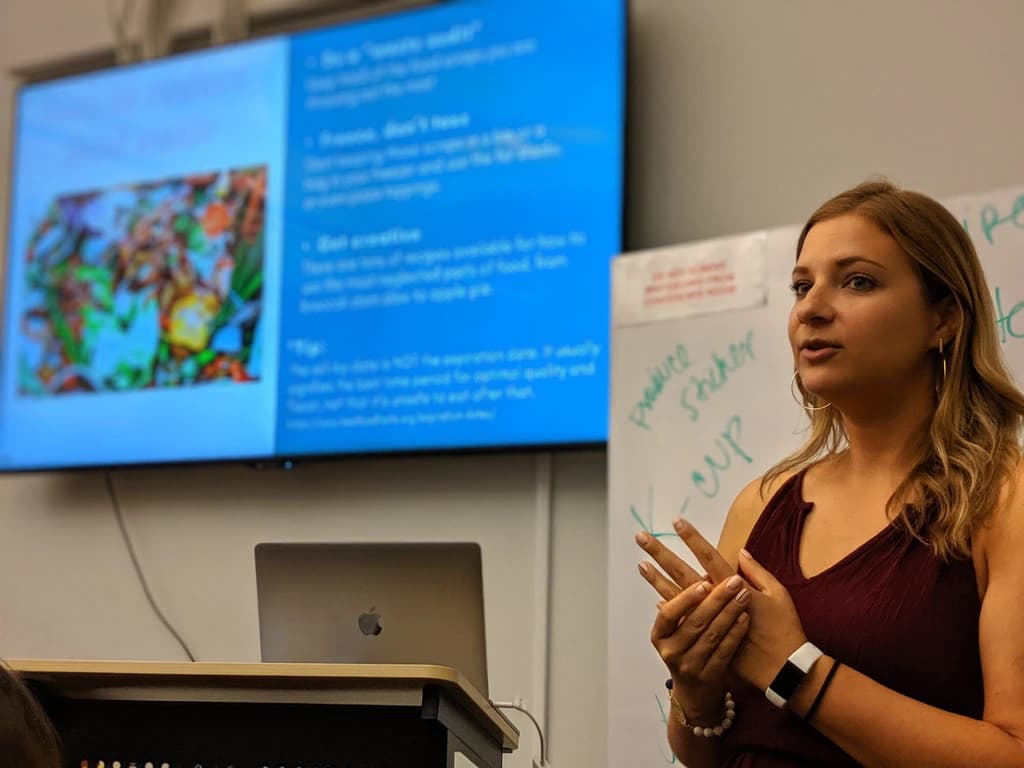 a women giving a presentation on sustainability