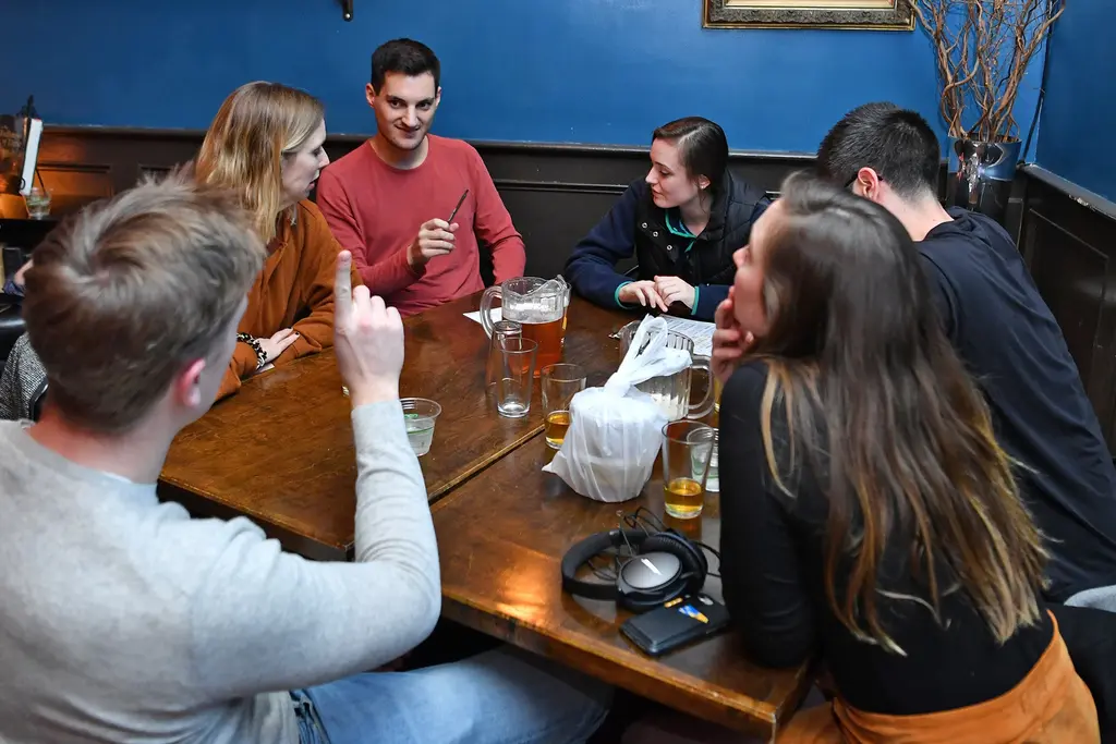 people at a table discussiong something on a piece of paper