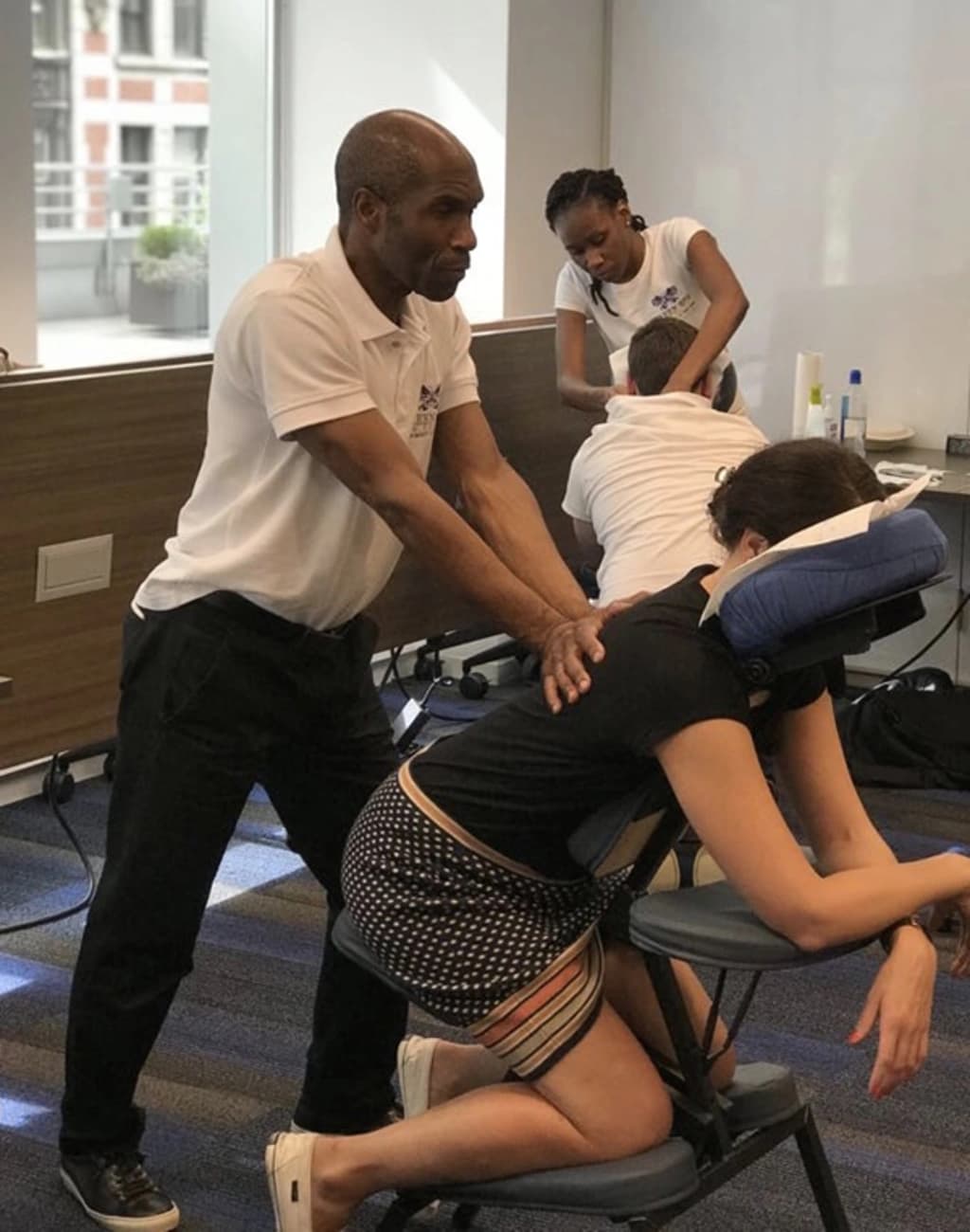 a women in a chair getting a massage