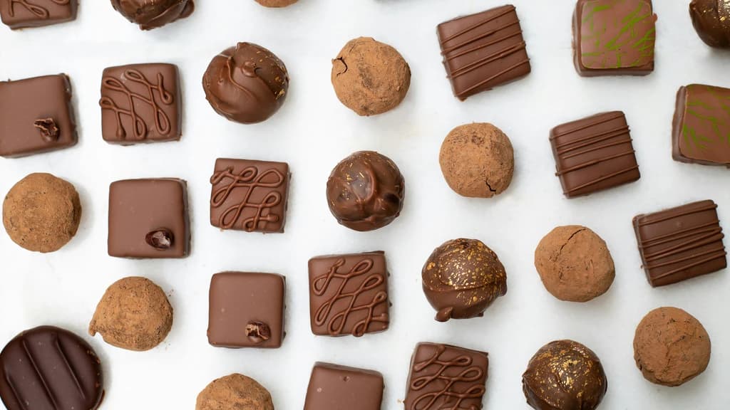 a table full of different chocolates