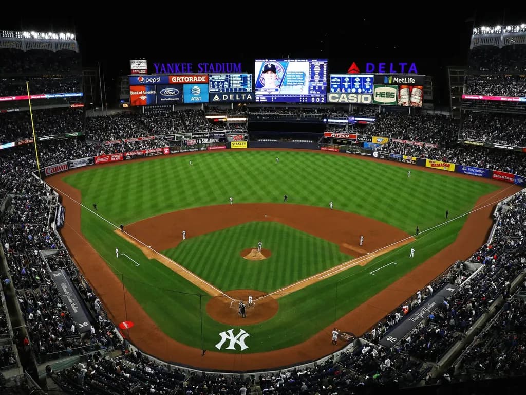 a view of yankee stadium from behind home plate